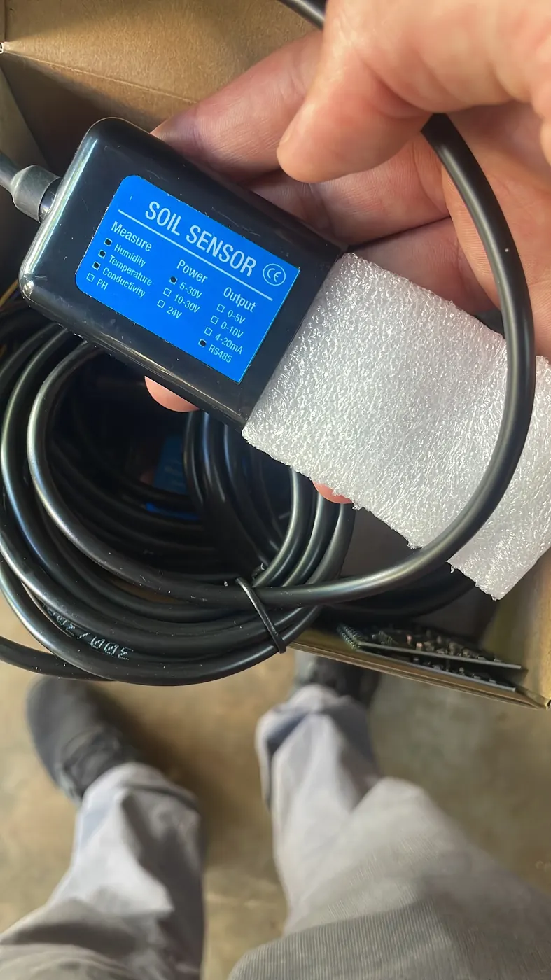 A new soil sensor and its coiled cable unpacked from the box